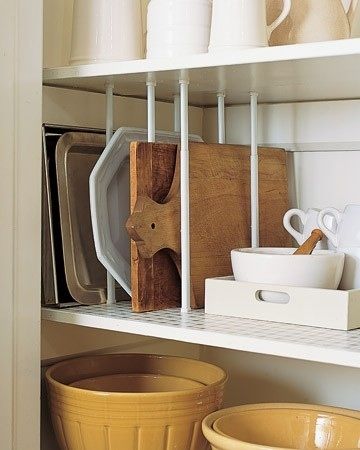 12-Easy-Kitchen-Organization-Tips-Use-tension-rods-as-dividers-for-upright-storage-2