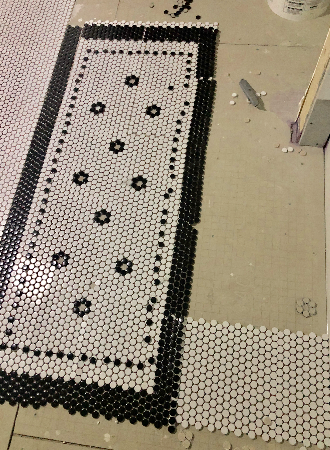 laying a tile rug