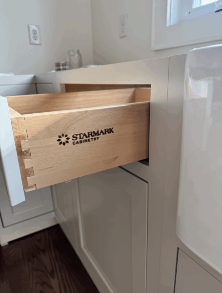 Close-up of dovetail joinery in maple drawer box.